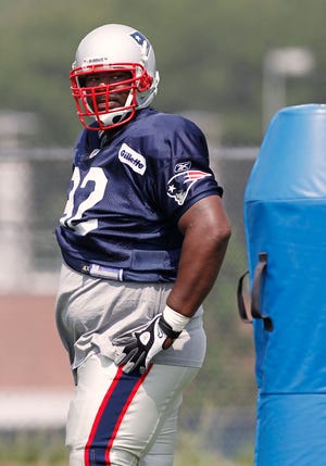 New England Patriots' Albert Haynesworth takes a breather during NFL football training camp in Foxboro earlier this month.