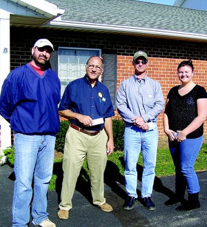 Poll workers at the Antrim 5 site greeted voters with campaign literature Tuesday during the municipal election. Pat Heraty, left, and Paul Politis were candidates for township supervisor and school board, respectively. Rick Baer sought votes on behalf of his wife Tracy, running for school board. Carly Mowen represented Scott Diffenderfer for supervisor.