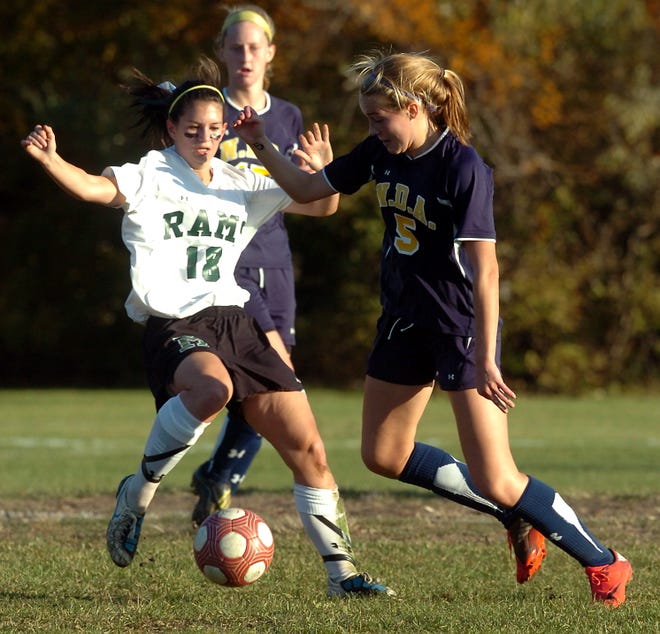 Marshfield's Abby Clapp (18) and Notre Dame's Madison Caron (5) battle for the ball, during girls soccer tournament action at Marshfield, Wednesday, Nov. 9, 2011. The host Rams won, 3-1.