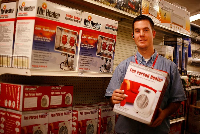 Chris Chenette a sales associate at Curry Hardware on Copeland Street in Quincy talks about the large variety of space heaters on the market. Some are small spaces, some for outdoor use. Thursday October 27, 2011.