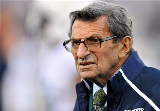 Penn State coach Joe Paterno stands on the field before his team's NCAA college football game against Northwestern on Saturday, Oct. 22, 2011, in Evanston, Ill. (AP Photo/Jim Prisching)