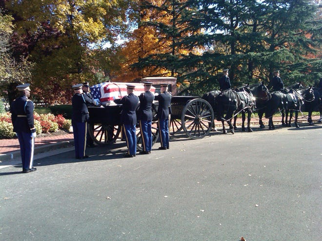 The burial services of the three soldiers missing in action from the Vietnam War, is seen at Arlington National Cemetery in Arlington, Va., Wednesday, Nov., 9, 2011. The remains represent the entire crew are being buried in a single casket are; Capt. Arnold E. Holm, Jr. of Waterford, Conn., Spc. Robin R. Yeakley of South Bend., Ind., and Pfc. Wayne Bibbs of Chicago.
