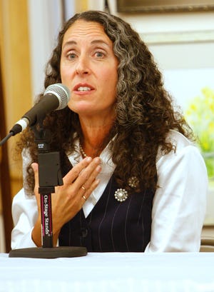 Kate Archard, running for city councilor-at-large, talks about city issues with the four other candidates at the Mary Cruise Kennedy Senior Center in Brockton on Wednesday, Oct. 19, 2011.
