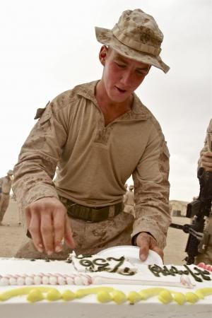 U.S. Marine Lance Cpl. Edward Doherty, 20, of Weymouth, cuts into a birthday cake for the Marine Corps, which turned 236 on Thursday. Doherty is in Afghanistan. 
Marine Corps photo