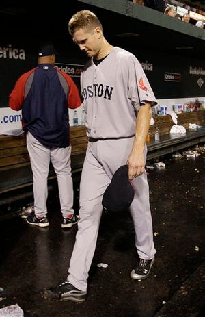 Boston Red Sox relief pitcher Jonathan Papelbon walks out of the dugout after the Red Sox's 4-3 to the Baltimore Orioles in a baseball game Wednesday, Sept. 28, 2011, in Baltimore.