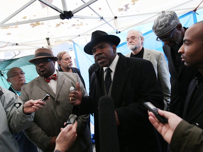 Rev. Charles E. Williams, Sr. from Historic King Solomon Missionary Baptist Church speaks with other local clergy members during a news conference in Detroit, Wednesday, Nov. 9, 2011. A coalition of Detroit clergy and community activists plan to march to a downtown football stadium and hold a prayer rally while thousands gather inside for a 24-hour Christian event known as TheCall. (AP Photo)