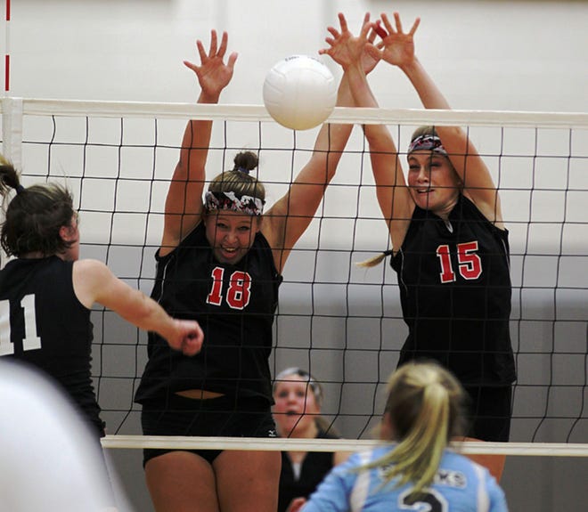 Creekside's Sam Borntraeger (18) and Erika Hinel (15) defend the net against Nature Coast's Courtney Crawford (11) in the Region 2-5A final on Saturday.
