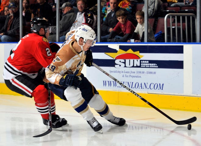 Adam Cracknell of the Rivermen controls the puck during Friday's AHL game at Carver Arena.