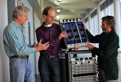The Arista Networks founders, Andreas Bechtolsheim, left, David Cheriton and Kenneth Duda, with a data-routing switch at the company's headquarters in Santa Clara, Calif.