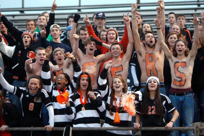 Oliver Ames High School girls varsity soccer fans scream and cheer during the Division 1 final against Whitman-Hanson Regional High School in Taunton on Sunday, November 13, 2011. OA won, 3-2.