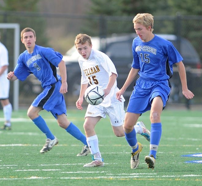Cardinal Spellman High School's Robert Studley (15) tries to beat Dover-Sherborn High School's Perry Fitz (15) and Walker Littlehale (9) to the ball during the Division 3 South championship game in Bridgewater on Sunday, November 13, 2011. The Cardinals won, 2-1.