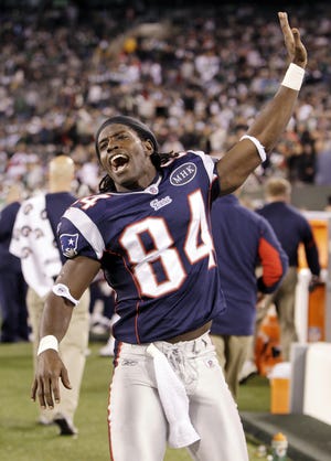 The Patriots’ Deion Branch celebrates scoring a touchdown Sunday during the fourth quarter of New England’s 37-16 win over the New York Jets in East Rutherford, N.J. The Patriots’ final seven games present few major challengers based on records, which puts them in good shape to win the AFC East title.