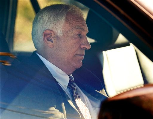 In this Nov. 5, 2011 file photo, former Penn State football defensive coordinator Gerald "Jerry" Sandusky sits in a car as he leaves the office of Centre County Magisterial District Judge Leslie A. Dutchcot in State College, Pa.