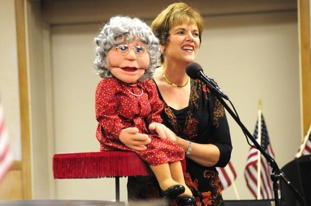 Ventriloquist Cindy Speck and Nellie, one of her dolls that
sings and jokes with the audience.
