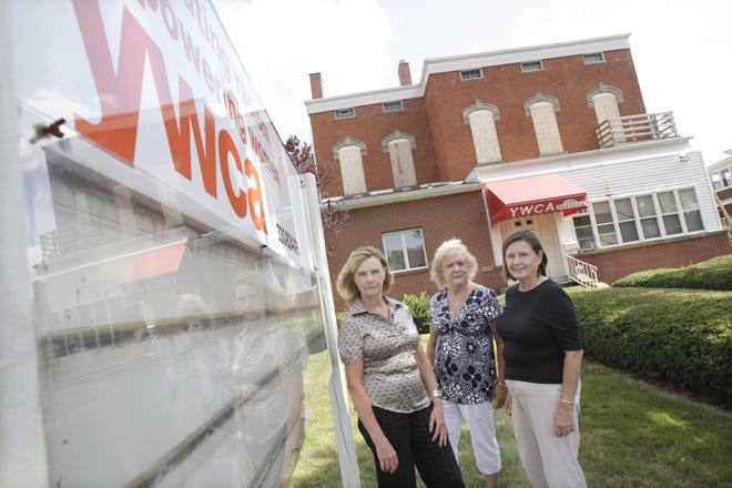 Massillon YWCA board members (from left) Linda McClintock, Diane Bell and Linda Nelson stand outside the closed YWCA on Lincoln Way E in Massillon. 
No Published Caption