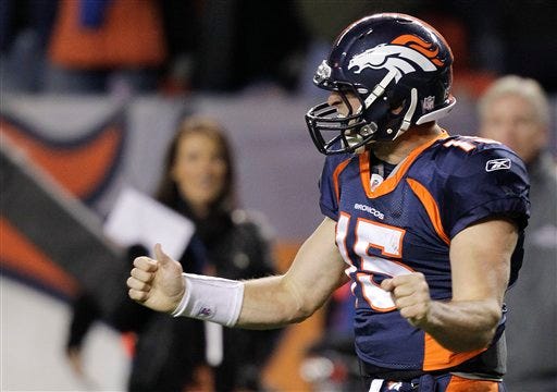 Denver Broncos quarterback Tim Tebow (15) reacts after scoring a touchdown against the New York Jets in the fourth quarter of an NFL football game, Thursday, Nov. 17, 2011, in Denver. Denver won 17-13.