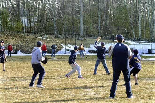 A group of 13-year-olds practice recently on a baseball field on property owned by the Massad family in Shrewsbury. The state Appeals Court has ruled that the Massads can no longer operate the field.