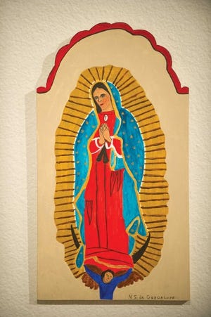 A traditional depiction of Nuestra Senora de Guadalupe (Our Lady
of Guadalupe) by Tafoya.