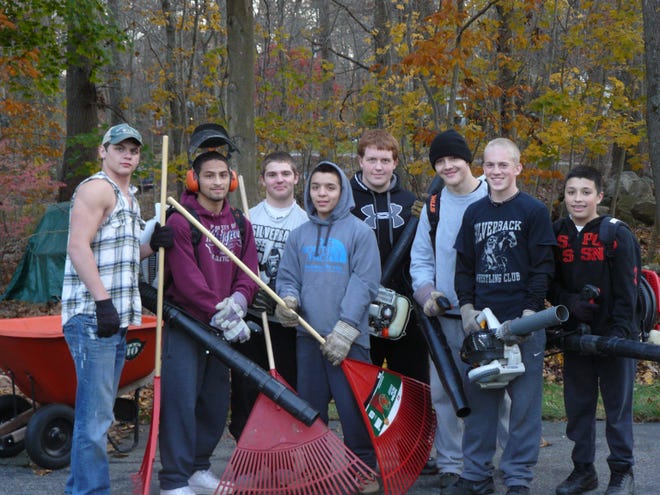 From left to right: Nick Poulin, Miguel Calixto, Jacob Schmalz, Mike Ruffino, Xavier Kernozek, Devyn Petsa, Jake Caskey and Sebby Ruffino all wrestle for the Silverback Wrestling Club, based out of Windham, and do yard work to earn money for the cost of tournaments they attend. 
BRETT POIRIER/THE BULLETIN
