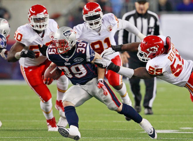 New England Patriots running back Danny Woodhead (39) scrambles against the Kansas City Chiefs during the third quarter of an NFL football game in Foxborough, Mass., Monday Nov. 21, 2011. (AP Photo/Elise Amendola)