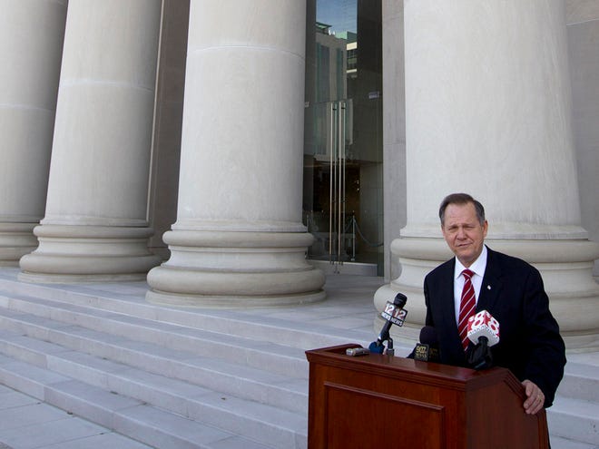 Former Alabama Supreme Court Chief Justice Roy Moore announces his candidacy for the state's top judicial office during a news conference in Montgomery, Tuesday.