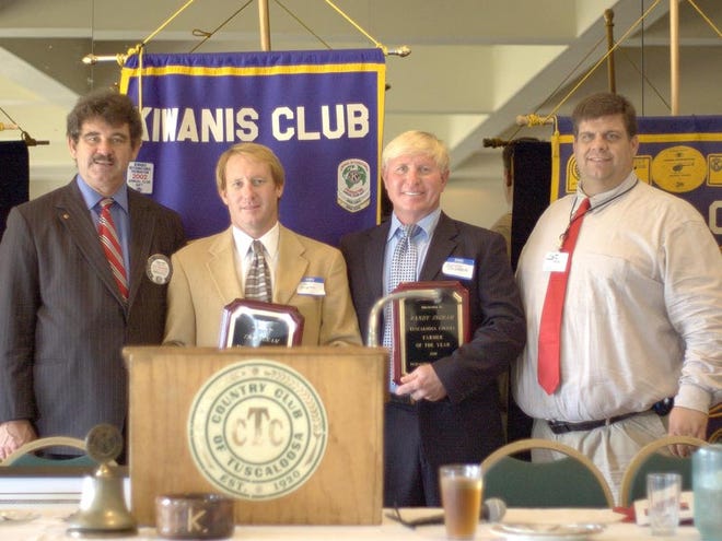 Tuscaloosa County and the Tuscaloosa Kiwanis Club held the Farm-City Banquet at the Country Club of Tuscaloosa on Monday. From left are Wayne Ford, retired County Extension Coordinator, Tim Ingram, Randy Ingram and Neal Hargle, County Extension Agent. The Ingrams were named Farmers of the Year.