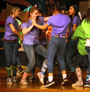 Photo from Xander Tielemans 
 Caroline Gallagher (with blue ribbon) dances during
Unami Middle School’s production of “Broadway Blast” last
year.