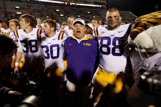 LSU head coach Les Miles celebrates with his players including tight end Chase Clement (88) and kicker Drew Alleman (30) following their 52-3 win over Mississippi in an NCAA college football game in Oxford, Miss., on Saturday.