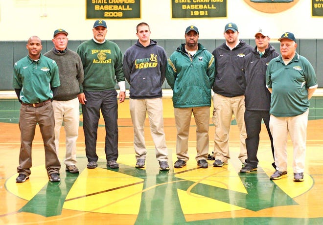 The New London coaching staff includes many former standouts. Coaches, from left, are Mike Morgan, Gary McNeil, Kent Reyes, Jay Bakulis, Juan Roman, Jeff Fox, Jeff Larson and Bob Nenna. Missing from photo is Tommie Major.