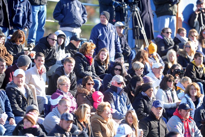 Fans bundled up and crowded the stands for the Thanksgiving Day football game between East Bridgewater and Rockland High Schools in East Bridgewater on Thursday, November 24, 2011.