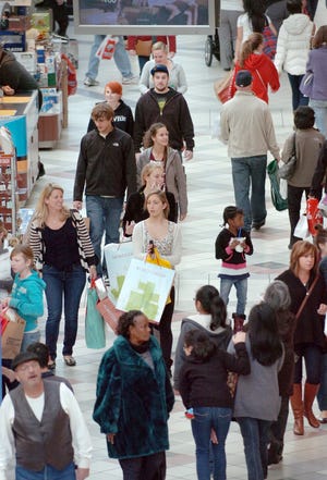 Shoppers look for bargains at the South Shore Plaza on Black Friday, in Braintree, Friday, Nov. 25, 2011.