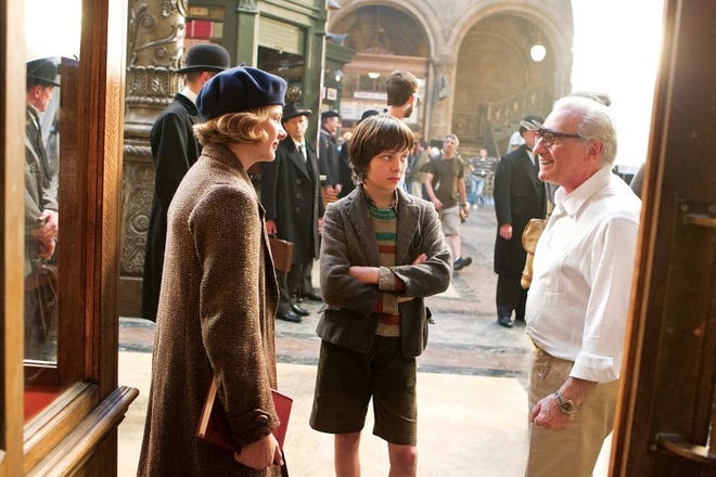 Emily Mortimer (left) and Asa Butterfield listen to director
Martin Scorsese on the set of ‘Hugo.’ The movie is Scorsese's first
attempt at filming in 3-D.