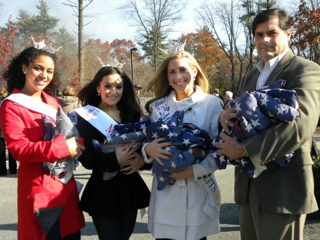 Miss New Bedford Marlena Johnson, left, Miss Taunton 2012 Nicole Di Blasi, Miss Massachusetts Molly Whalen and Roger Brunelle Jr. at the Oak Point Flag Retirement Ceremony in Middleborough