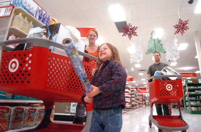 Julie England, of East Killingly, and her daughter, Jaylynn Sullivan, 2, shop on Black Friday at Target in Dayville.