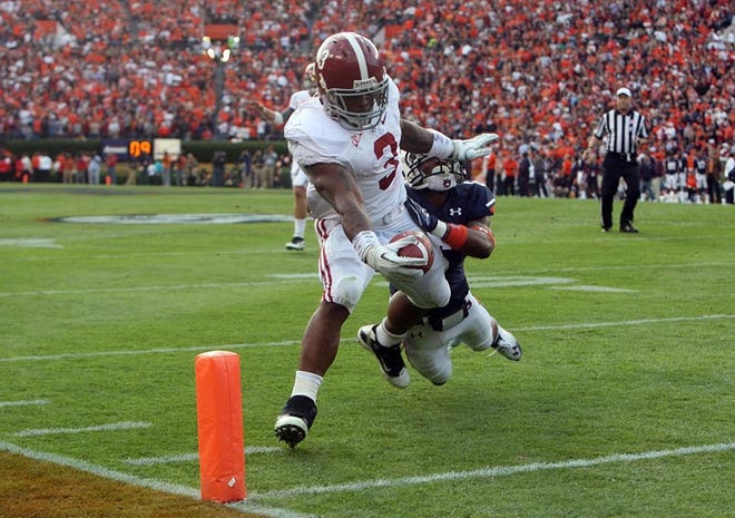 Alabama running back Trent Richardson crosses the goal line on a 5-yard touchdown pass in the second quarter. Richardson finished with a career-high 203 yards on the ground.