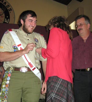 Hudson Eagle Scout Sterling Reber IV and his mother, Town Clerk Joan Wordell, participate in the pin ceremony.