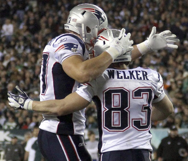 Patriots wide receiver Wes Welker (right) celebrates with tight end Rob Gronkowski after scoring a touchdown during News England's blowout win over the Eagles.