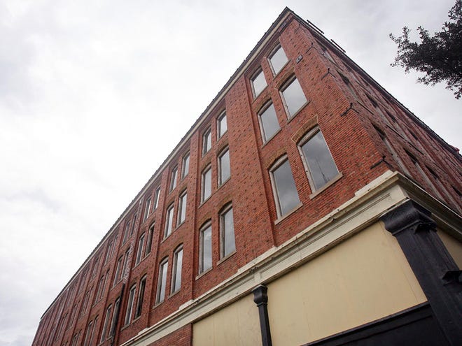 The former Allen and Jemison Building, left, which dates back to the turn of the 20th century, is being renovated into the Dinah Washington Cultural Arts Center. The building is on the corner of Greensboro Avenue and Seventh Street in downtown Tuscaloosa.