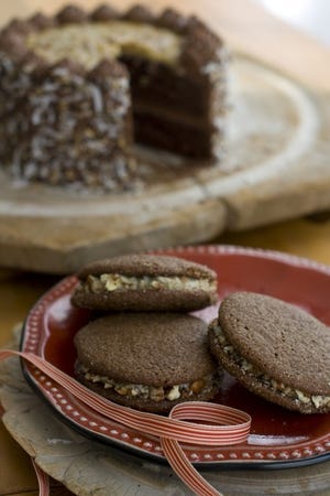 Matthew Mead / Associated Press 
 These indulgent sandwich cookies are inspired by German
chocolate cake, a purely American invention that consists of sweet
chocolate cake filled with a caramel-coconut-pecan concoction.