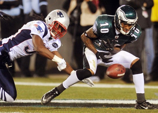 DeSean Jackson drops a deep pass in the end zone during the
third quarter Sunday as New England's Sergio Brown defends.