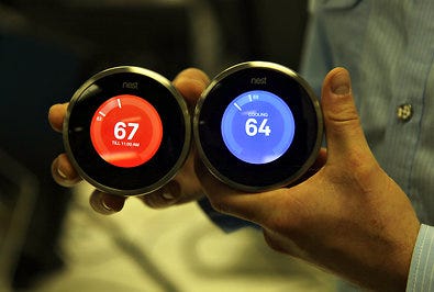 Nest Learning Thermostats, above, with color-coded high and low temperatures.