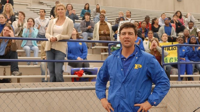 Kyle Chandler, center, and Connie Britton, left, starred in 'Friday Night Lights,' now available as a DVD box set that features a yearbook, deleted scenes and commentary from cast and crew.