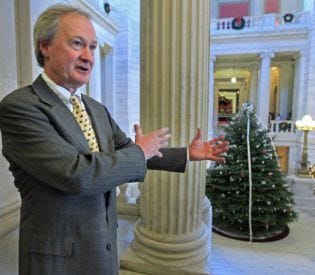 Rhode Island Gov. Lincoln Chafee, above, defends the ‘holiday tree' in the rotunda of the State House in Providence yesterday.