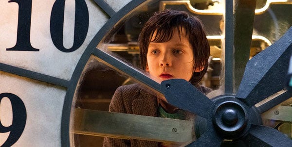 In “Hugo,” Asa Butter.eld portrays Hugo Cabret, an orphan who keeps the giant clocks working in a 1930s Paris train station.