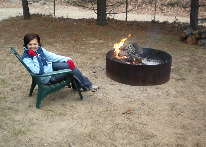 After the raking was done, my nephew's wife, Mandy, took advantage of the fairly mild weather and built her own campfire.