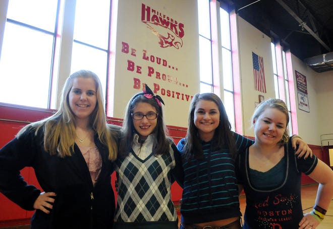 From left, Milford High School students Nikki Tusino, 16, Kelsey Gaffney, 16, Kara DiGregorio, 14, and Layla Sheridan, 16, are part of a group of student leaders that will discuss the initiative, of starting a unified track program, at the high school to interact with students with disabilities.