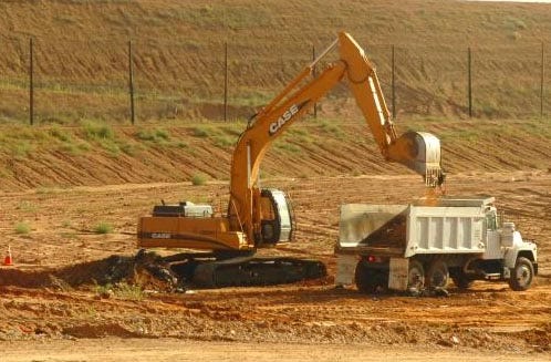 Contractors hunt for the body of Joanna Rogers at the city of Lubbock landfill. Rogers' body was found in the landfill in 2006. Her suspected killer, Rosendo Rodriguez III, is on trial for the murder of Summer Baldwin, whose body also was found in the landfill.