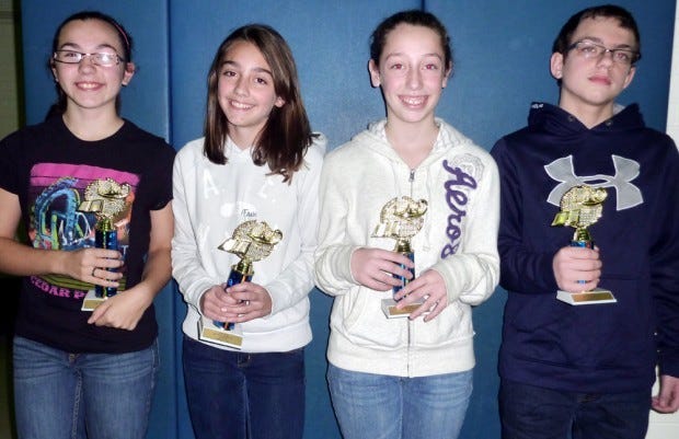 The top eighth graders in a Math 24 competition Thursday at Holy
Redeemer School were, from left, Cayla Sudano of Ellwood City,
first place; Shanna Ridgley of Riverside, second place; Katie Stang
of Riverside, third place; and Dom Teolis of Ellwood City, fourth
place.
