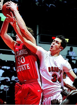 File photo - Milos Knezevic of Bradley (34) tries to grab a rebound from Blake Mishier during a game against Illinois State University at Carver Arena.
