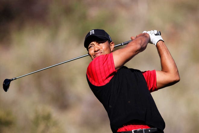 Tiger Woods tees off on the 14th hole during the final round of the Chevron World Challenge golf tournament at Sherwood Country Club, Sunday, Dec. 4, 2011, in Thousand Oaks, Calif. (AP Photo/Danny Moloshok)